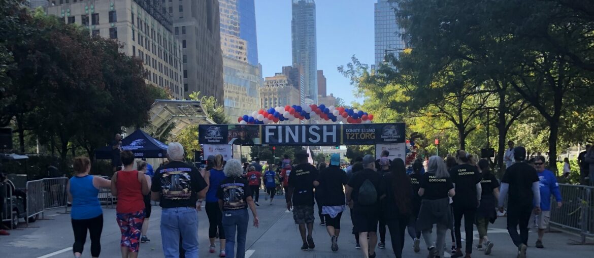 People marching with New York skyline in the background