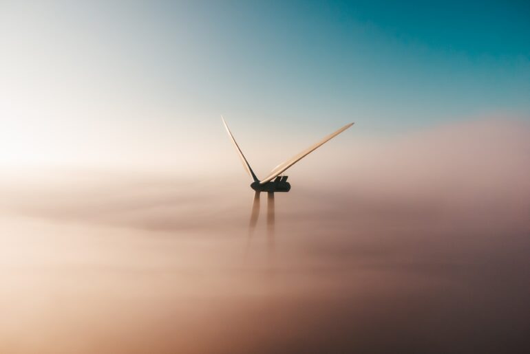 Early morning windmill sunrise in the mist