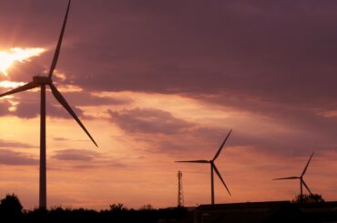 wind farm at sunset with clouds
